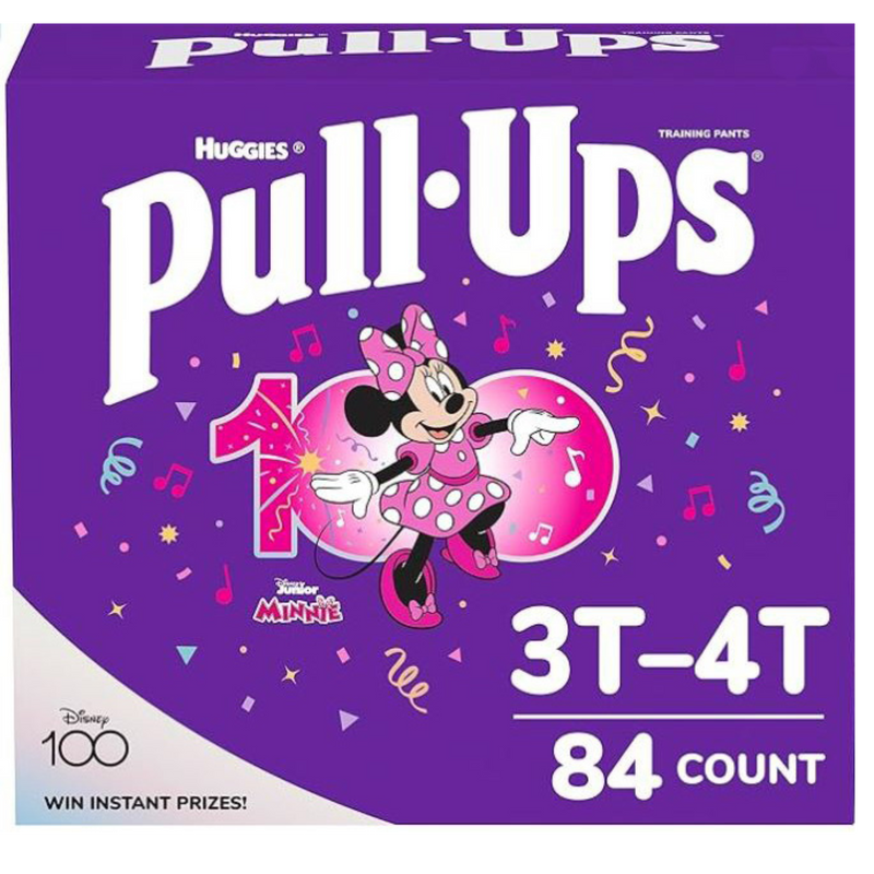 A purple box of Huggies branded pull-up training pants for girls. A graphic of Minnie Mouse is shown underneath the product label with the size being 3T to 4T, with a count of 84. 