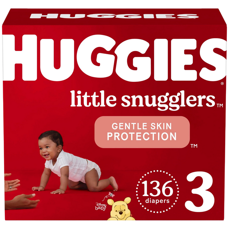 A box of Huggies little snugglers branded diapers, labeled "Gentle Skin protection". An infant baby is shown crawling next to the Huggies label. A total count of 136 diapers are in the box.
