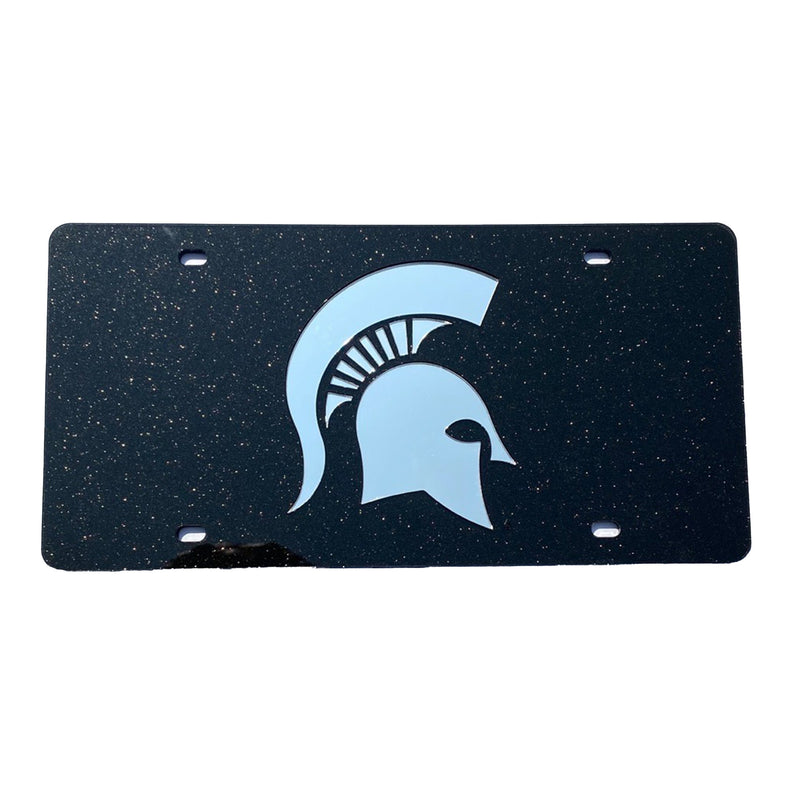 A black glittery license plate with a silver Spartan helmet and holes for screws in each of the four corners.