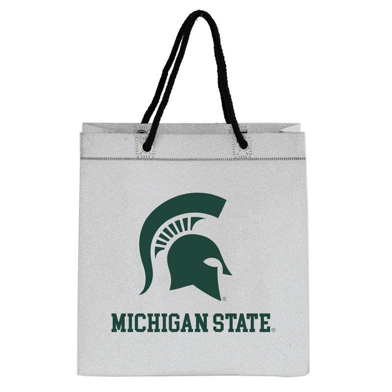 Glittery silver gift bag with black rope handles. A large green Spartan helmet and Michigan State underneath in block letters.