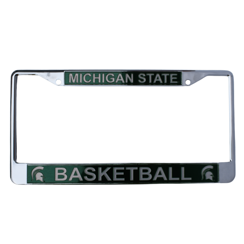 Chrome license plate with two screw holes at the top. A forest green block along the top reads "Michigan State" in all caps, and a matching block at the bottom reads "Basketball" between two Spartan helmets.