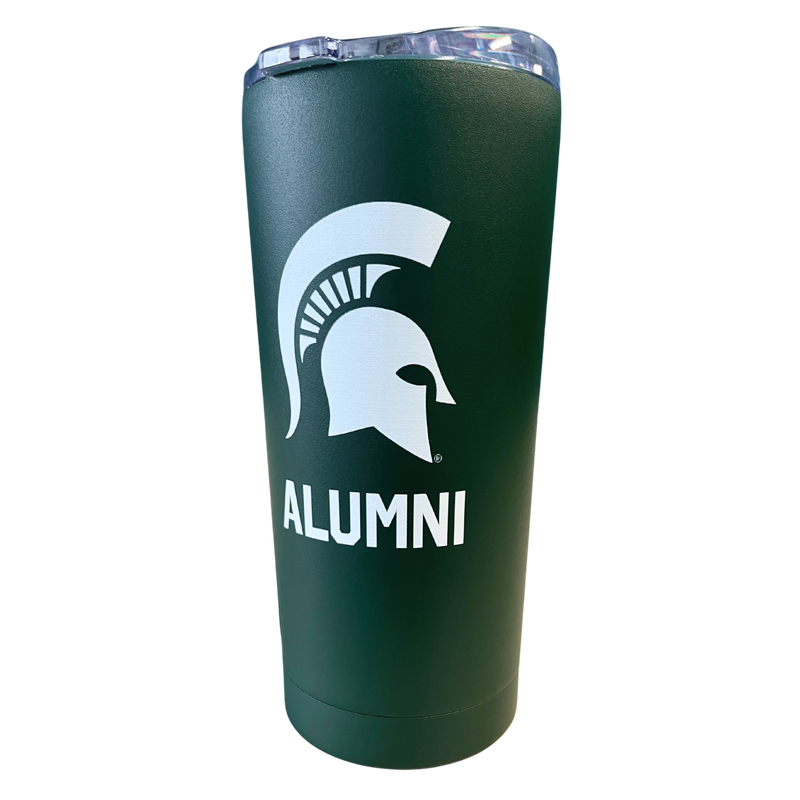 A dark green stainless steel tumbler with a white Michigan State Spartan helmet logo on the side. Underneath the logo in white, capital letters is the word Alumni.