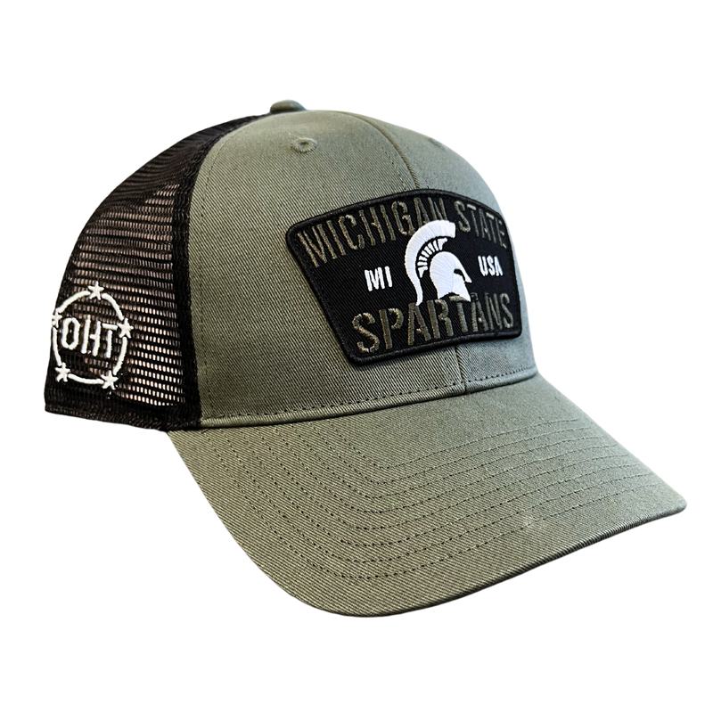 A moss green trucker hat with a black netted back. The graphic on the hat reads "Michigan State Spartans" in moss with MI, USA, and a spartan helmet logo centered in white.