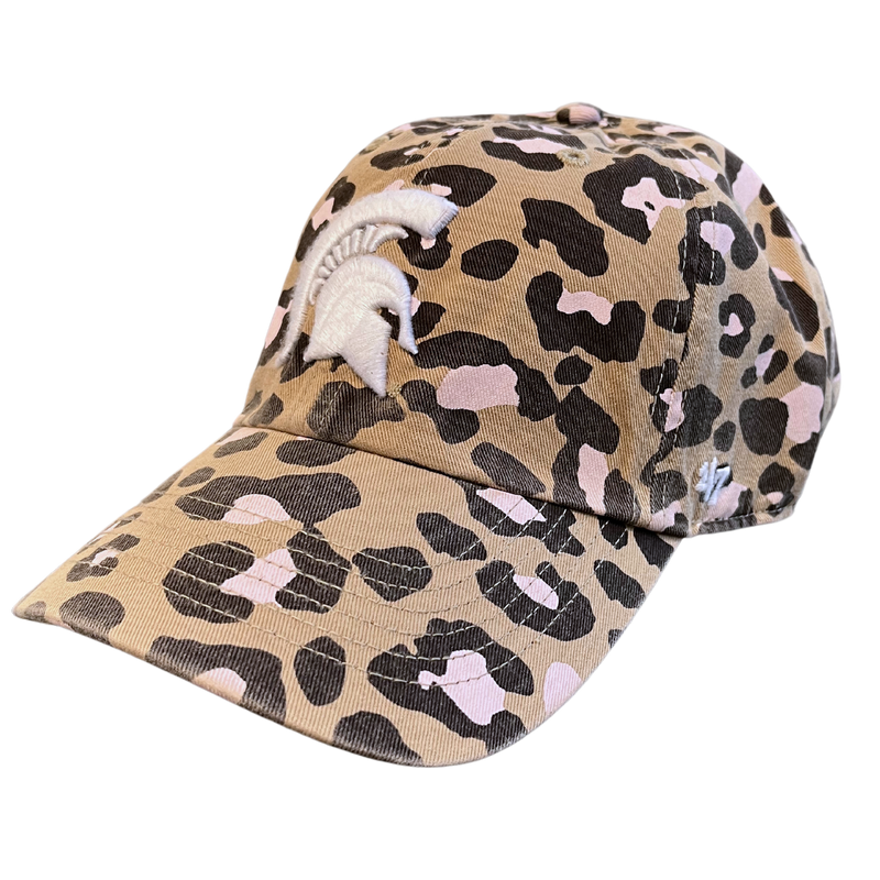 An angled view of a khaki baseball cap composed of a dark brown and pink leopard print. On the front panel is an embroidered white Michigan State Spartan helmet logo. The left temple panel features an embroidered white ’47 logo