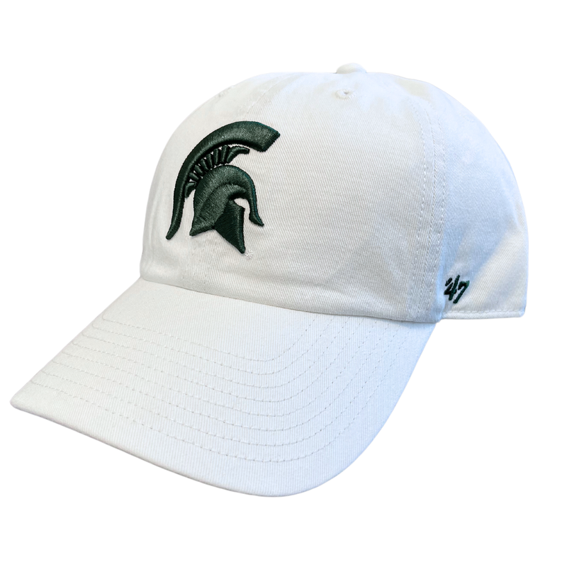 An angled view of a white ball cap with a dark green Michigan State spartan helmet logo embroidered on the center face of the hat. On the left temple panel is a dark green embroidered '47 logo