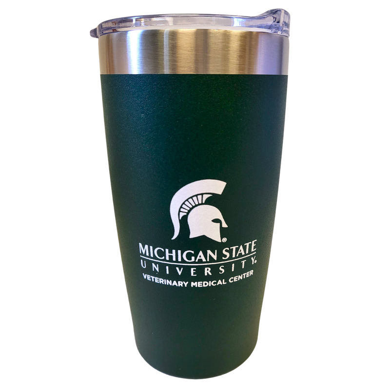 A curved stainless steel drink tumbler with a forest green powder coating on the bottom 90%. Printed in white on one side is a large Spartan helmet centered over the Michigan State University wordmark logo and bold block letters reading “Veterinary Medical Center.”