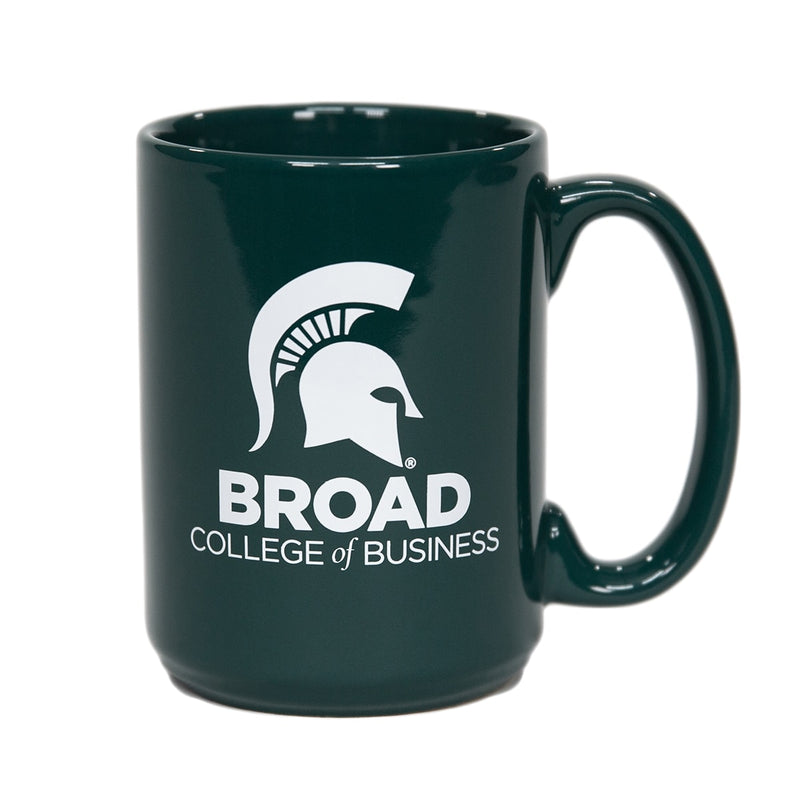 Dark green ceramic mug with a C-shaped handle. A white Spartan helmet is printed above all caps reading Broad. Below that is a line in smaller font reading College of Business