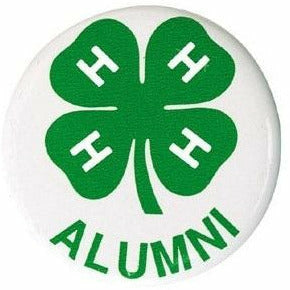 A white button with a green 4H clover logo. The word "Alumni" is spelled in all caps underneath the logo. 