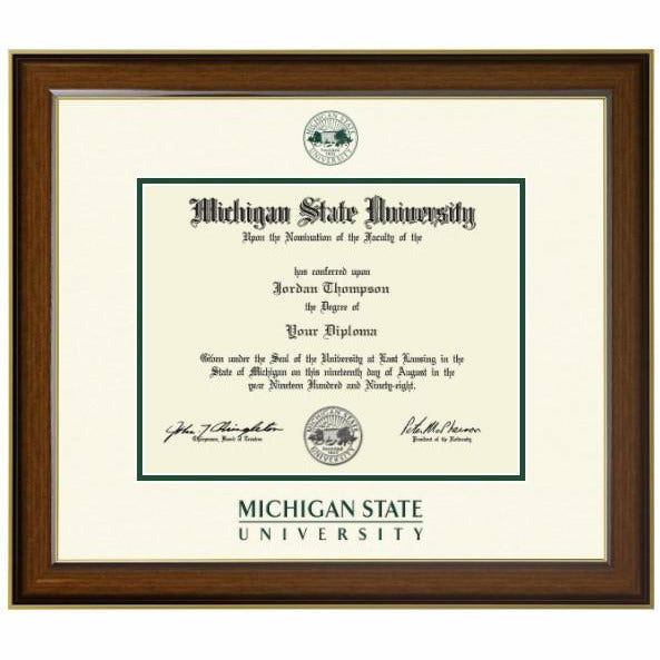 MSU diploma inside a thin strip of dark green mat. Top white mat is embossed with the university seal at the top and the university wordmark at the bottom, both in forest green. Frame is a reddish wood 