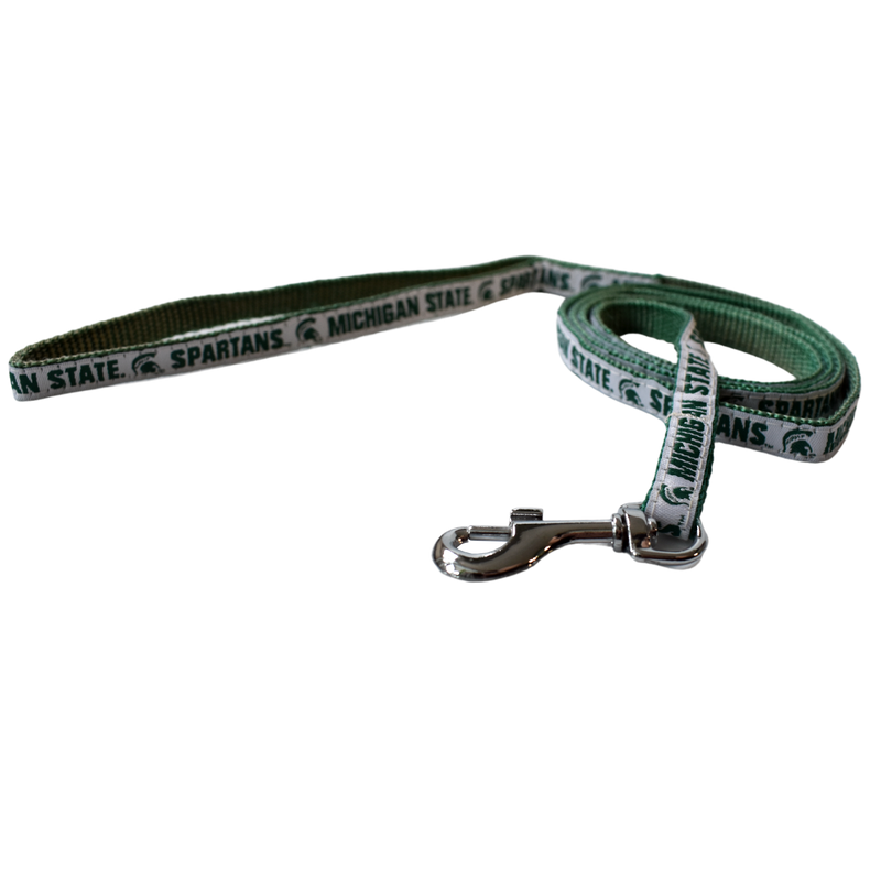 Green woven leash with one side having a solid white ribbon that reads Michigan State and Spartans on either side of a Spartan helmet, all in dark green. At one end is a silver metal spring hook.