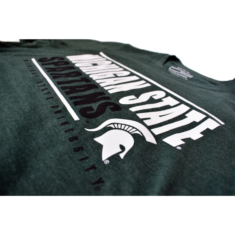 Close-up of the Michigan State Spartans, Spartan helmet, and Michigan State University print on the center chest of the green t-shirt.