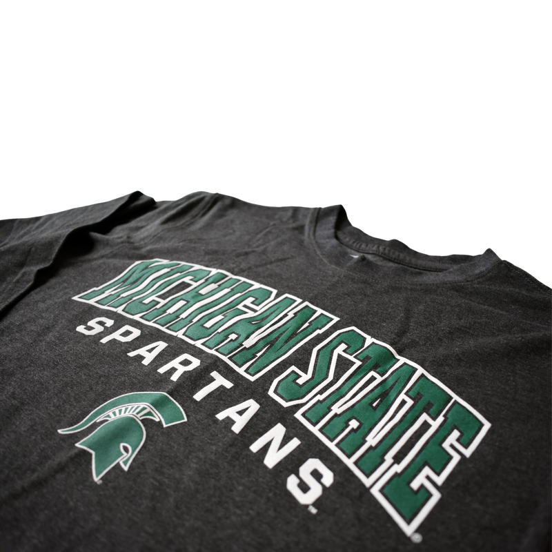 Close-up of the Michigan State Spartans and spartan helmet print on the center chest of the charcoal t-shirt.