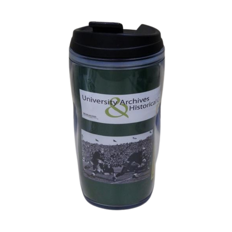 Clear travel mug with a black lid. Through the clear exterior, a green graphic with the University Archives and Historical Collections logo is over a vintage photo of the Spartan football team.