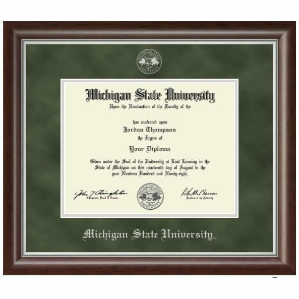 MSU diploma inside a thin strip of silver mat. Top army green mat is embossed with the university seal at the top and old English style font reading "Michigan State University" at the bottom, both in silver. Frame is a dark brown wood with silver trim inside