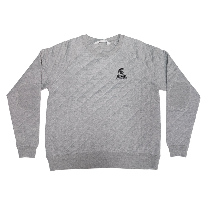 Light gray quilted pullover crewneck sweatshirt with a forest green embroidered Spartan helmet over the Broad Supply Chain Management logo on left chest. Patches embroidered on elbows.