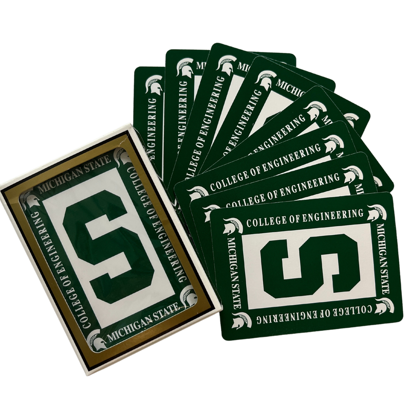 Green-backed playing cards that have a white rectangle in the center with a cutout block S. Around the rectangle are four Spartan helmets and text reading Michigan State College of Engineering.