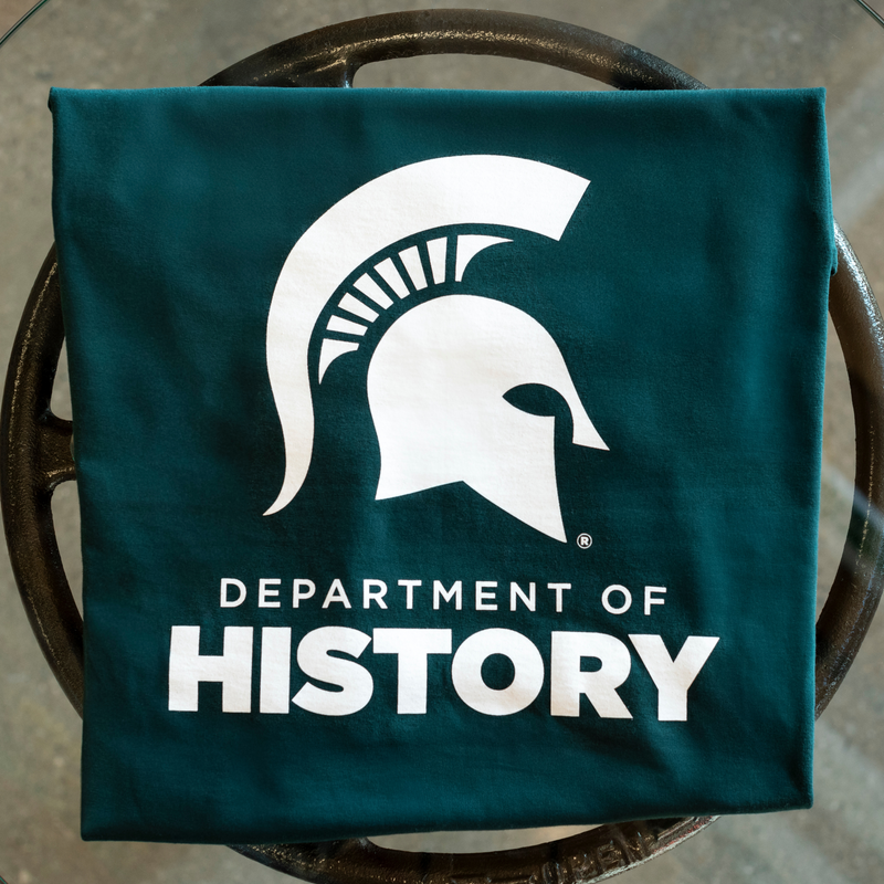 Forest green T-shirt featuring the Spartan helmet above the text ‘Department of History’ printed in white.