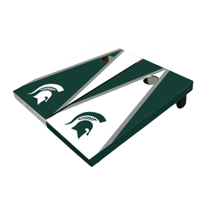 Two side-by-side cornhole boards. The left board is white, with a green isosceles triangle with a gray outline, angling toward the hole. Centered at the bottom of the surface is a large white Spartan helmet. The other board is green, with a white isosceles triangle with a gray outline, angling toward the hole. Centered at the bottom of the surface is a large green Spartan helmet.