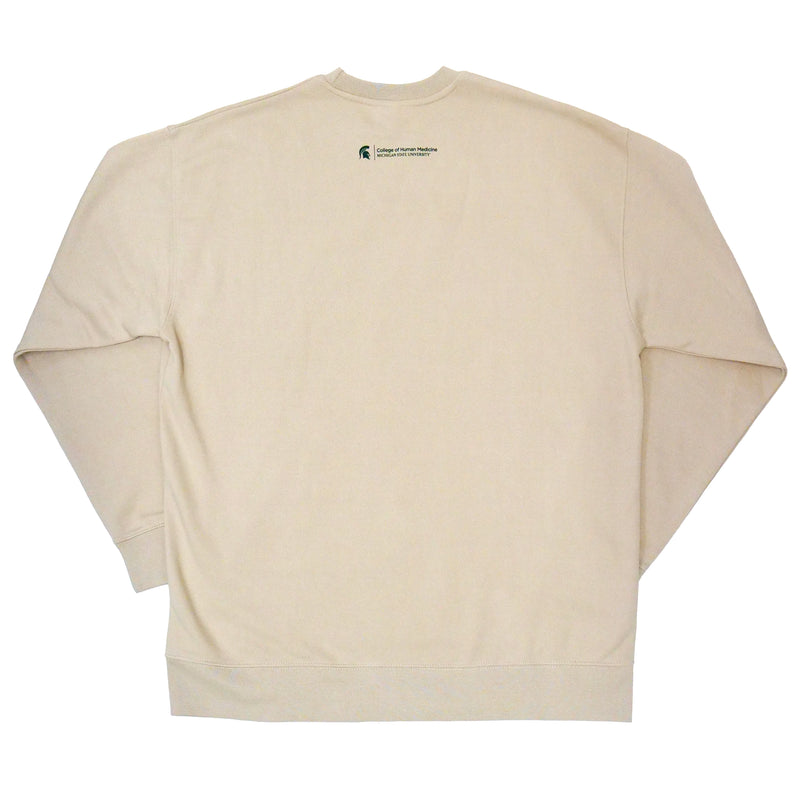 The back of a cream crewneck sweatshirt. On the top center there is a green Michigan State spartan helmet logo with the words" College of Human Medicine, Michigan State University" written in green to the right. 