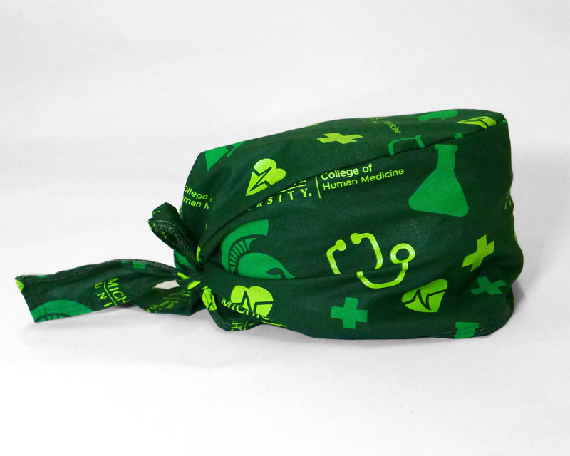 Forest green scrub cap. Features lime green and kelly green medical icons all over print. Back tie. 