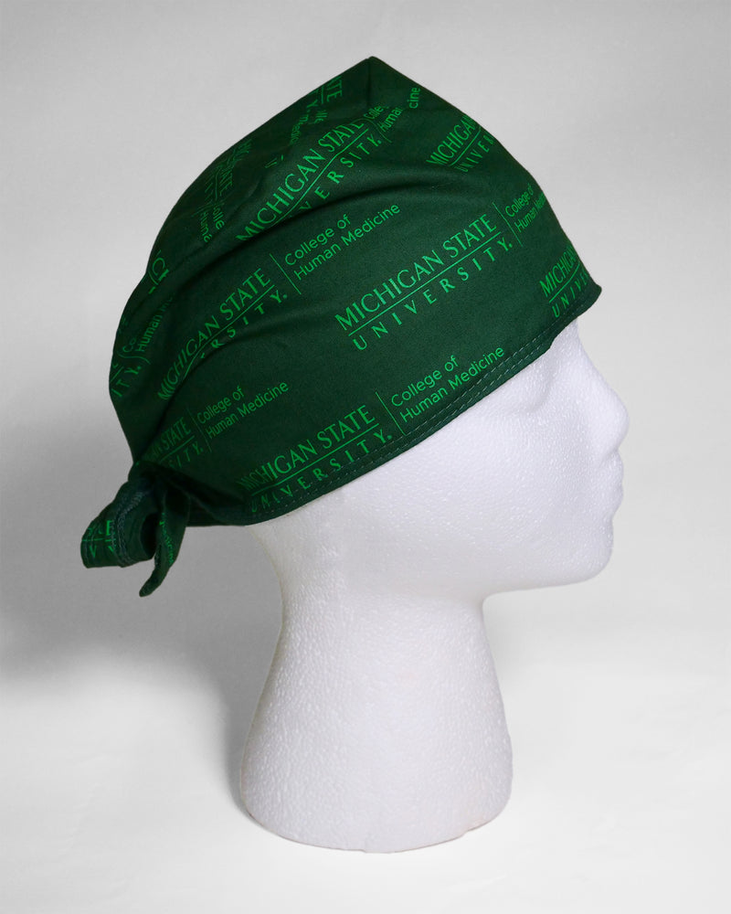 Tonal forest green on green Michigan State University College of Human Medicine logo on scrub cap with back tie. 