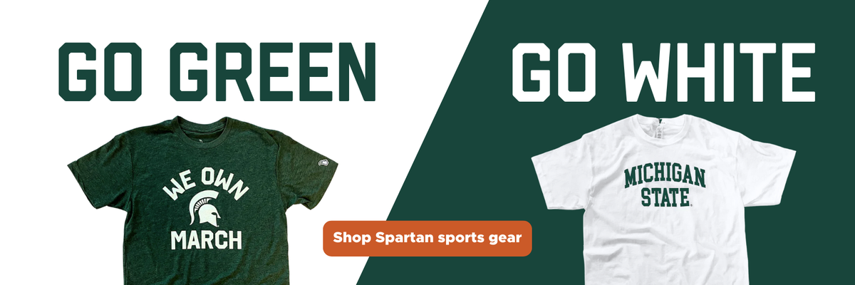 A green and white banner. In the white portion of the banner, in green text, are the words "Go Green" with a green "We Own March" Michigan State tee shirt underneath. In the green section, which is on the right side of the graphic, white text reads "Go White" with a white Michigan State tee shirt underneath. In the bottom center of the graphic is an orange button labeled "Shop Spartan Sports Gear". 