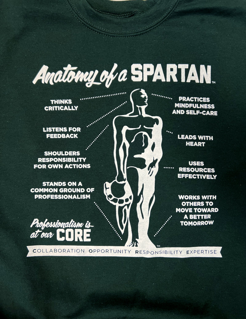 Close-up of the Anatomy of a Spartan graphic. Text blocks read (from top left to bottom right): Thinks critically. Listens for feedback. Shoulders responsibility for own actions. Stands on a common ground of professionalism. Practices mindfulness and self-care. Leads with heart. Uses resources effectively. Works with others to move toward a better tomorrow.