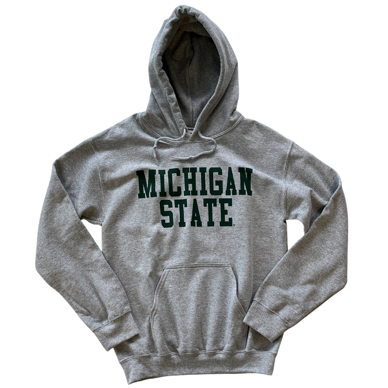 Head-on view of light gray hooded sweatshirt with large front pocket. Across center chest, green block letters read "Michigan State"
