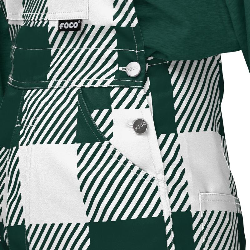 Close up of the fastening buttons of green and white Michigan State University overalls.