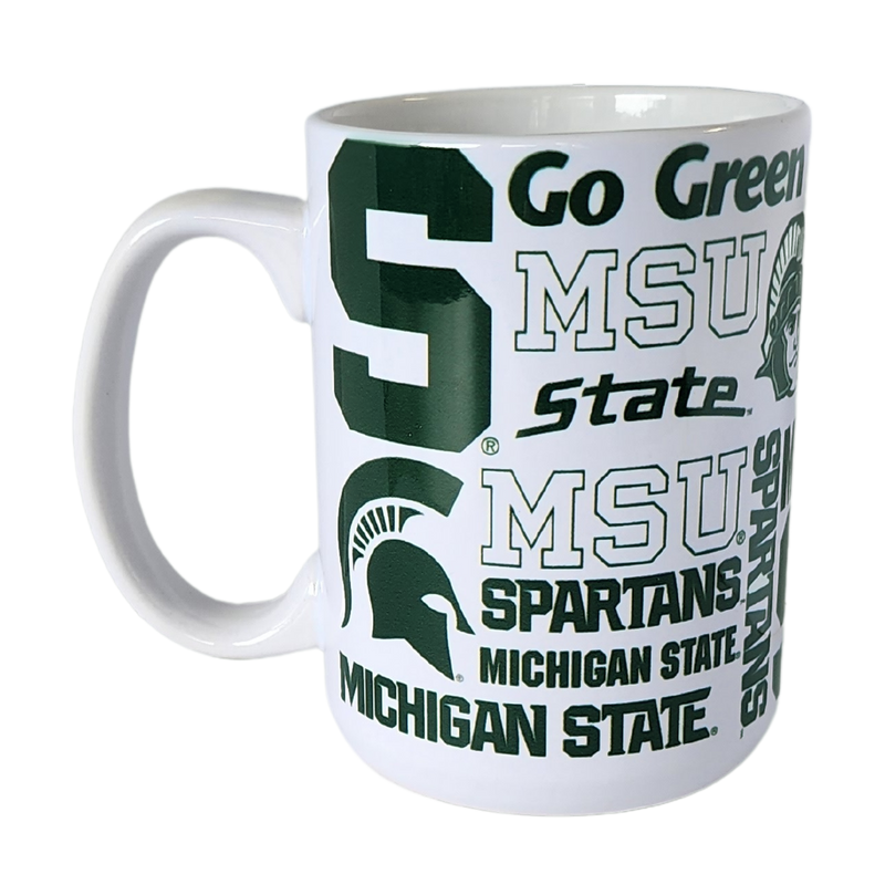 White ceramic mug with a c-shaped handle. Green Spartan iconography (including block S, Spartan helmets, and various text lines) are patterned across.