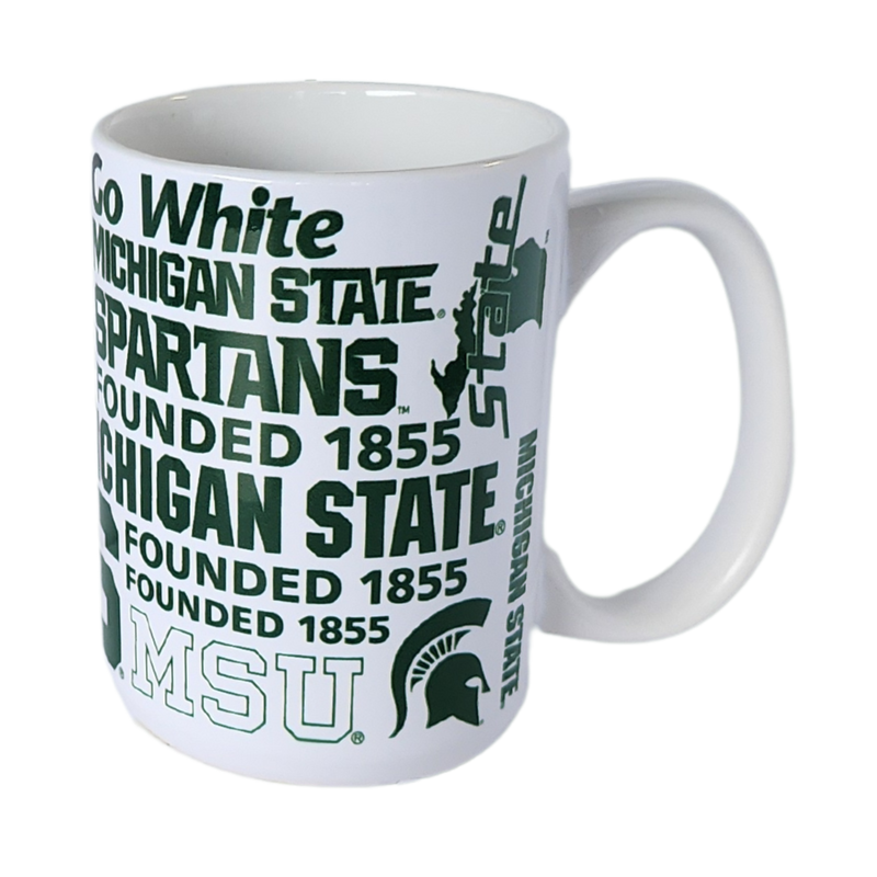 White ceramic mug with a c-shaped handle. Green Spartan iconography (including block S, Spartan helmets, and various text lines) are patterned across.