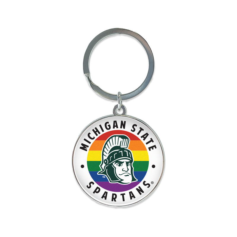 Chrome key chain with a key ring and around chrome circle with a curved Michigan State at top and Spartans at bottom. Middle is rainbow striped with a cartoon green and white Sparty mascot head.