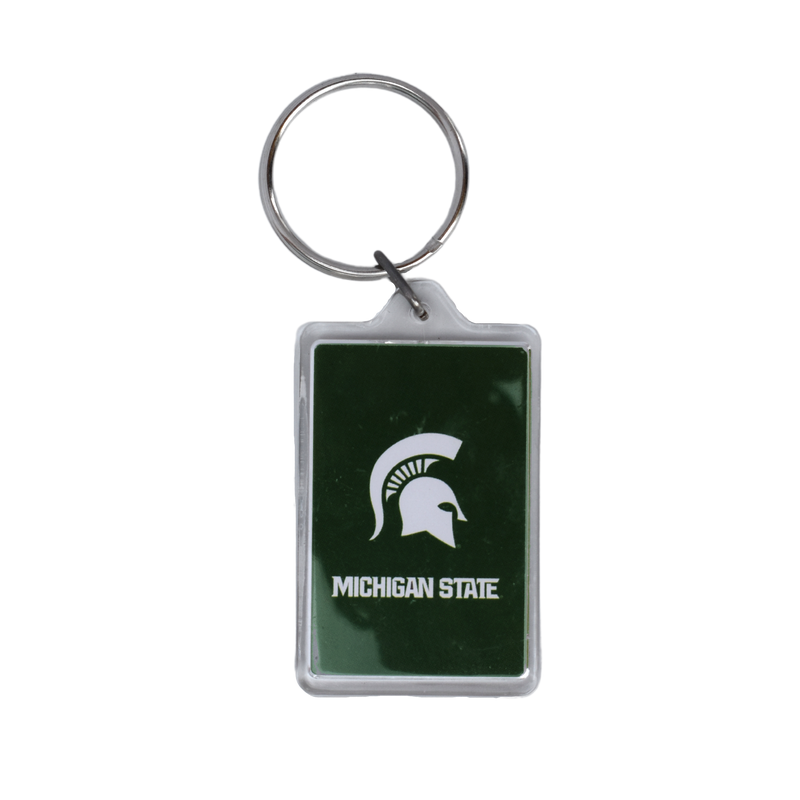Clear, rectangular keychain with a dark green insert that features a large white Spartan helmet and white bold text reading Michigan State in all caps. Tag is attached to a silver keychain.