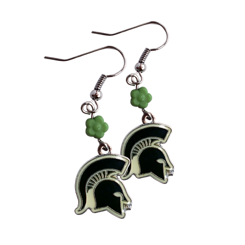 Silver dangle earrings with an enamel green and off-white Spartan helmet charm at the bottom. Connecting the helmet to the hook is a bright green 3D flower charm