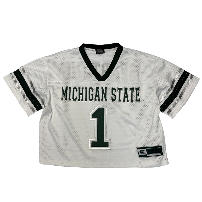 A white, cropped Michigan State jersey with a green neckline and sleeve cuffs. The torso has Michigan State written in all caps with the number one in green underneath. 
