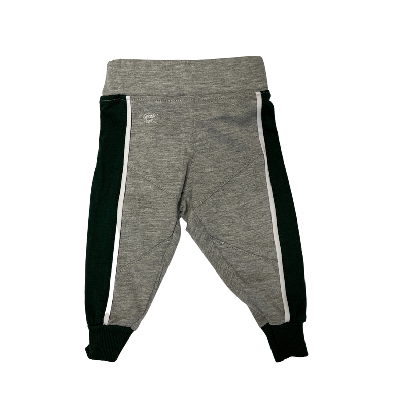 Grey infant sweatpants with green lines going down the side of the pant legs. 