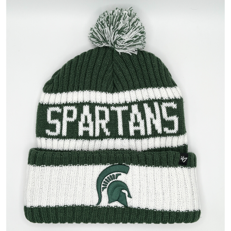 A pom beanie alternating in dark green and white. On the front of the beanie is a green MSU spartan helmet logo. Above the logo is the word "Spartans" written in all caps in white. 