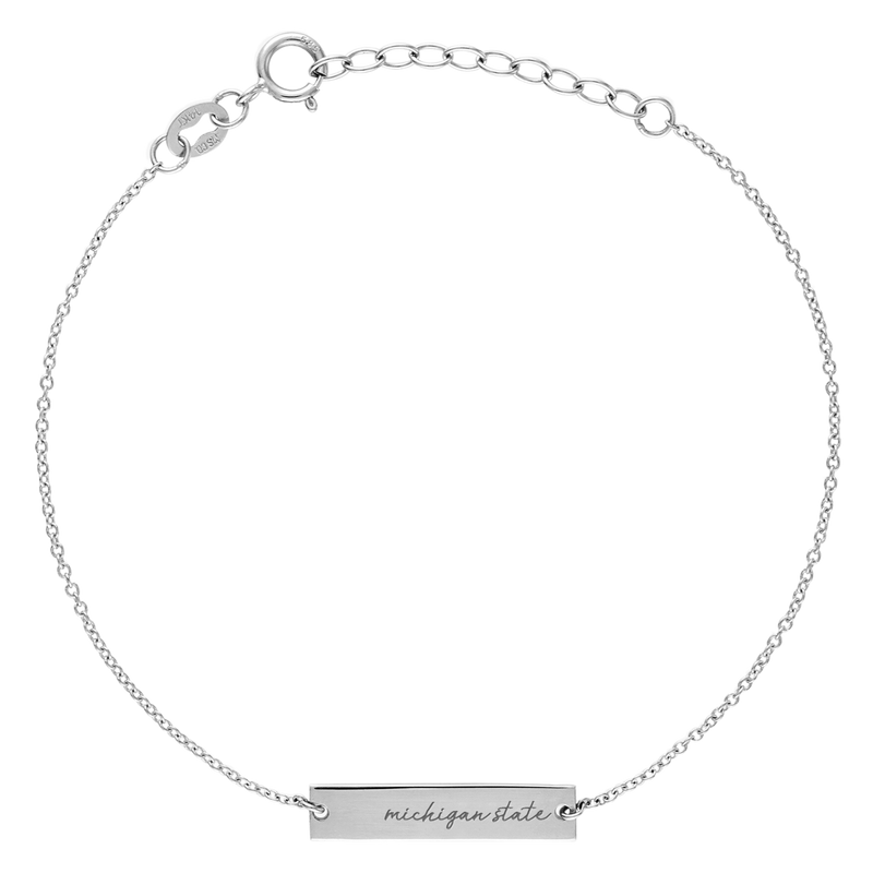 A silver, 7 inch cable chain bracelet with a small silver bar on it that reads Michigan State in cursive. 