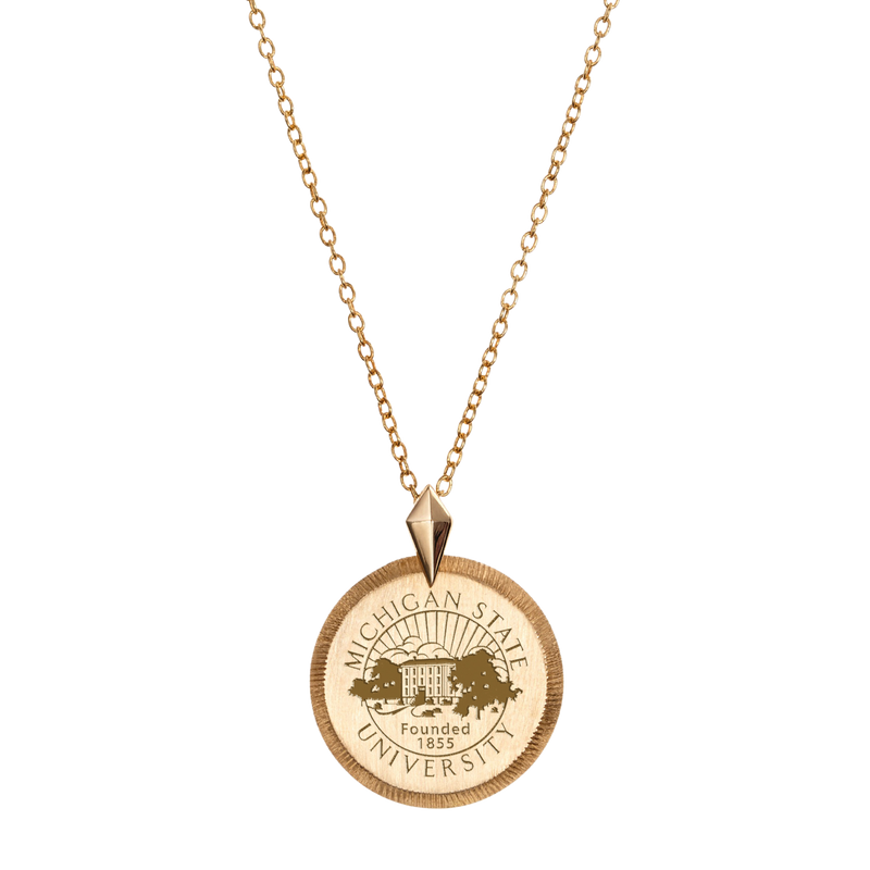 A gold coin necklace with the Michigan State University seal in the middle of the coin medallion.