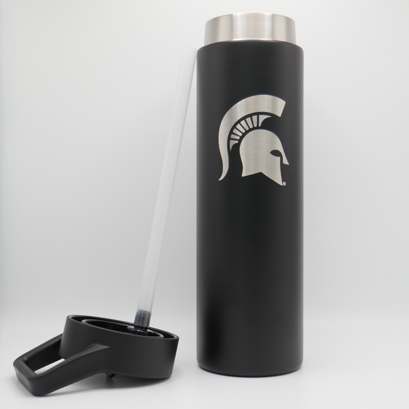 Cylinder powder coated black tumbler. Black plastic lid with carry handle on top. Spartan helmet design etched vertically on body of tumbler.  The straw and lid are sitting on the left side of the tumbler. 