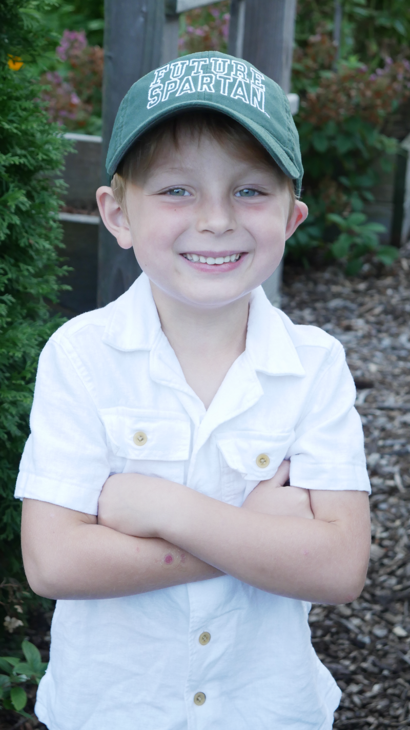 Youth forest green twill hat. White embroidered "FUTURE SPARTAN" in capital block lettering on front panel. 