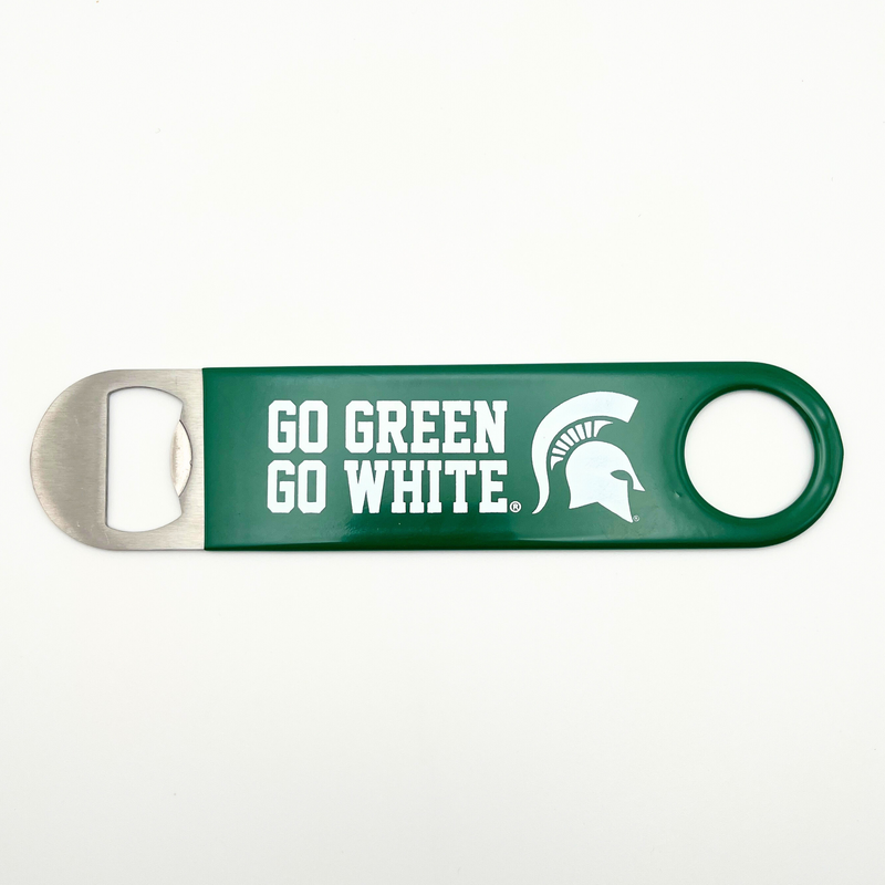 A green metal bottle opener with the words "Go Green Go White" written in white on the side along with a white MSU spartan helmet logo. 