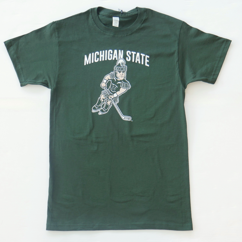 A forest green shirt with white text reading "Michigan State" above an image of Sparty wearing skates and holding a hockey stick.