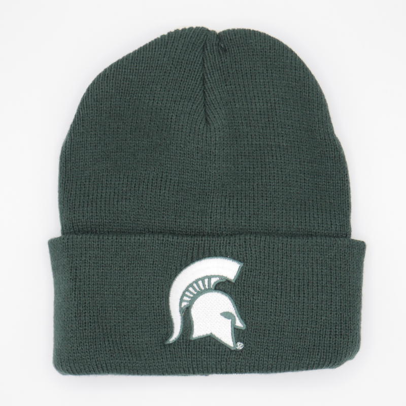 A green knit beanie hat with a white Michigan State spartan helmet logo in the lower center of the beanie. 