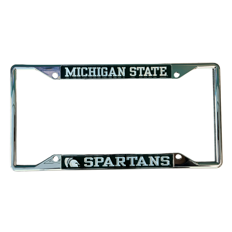Chrome license plate frame with green colored bars along the top and bottom. Bar at the top is printed with Michigan State in white. Bar at the bottom is printed with a zoomed-in Spartan helmet and Spartans in white. The bars have mounting holes at each end.