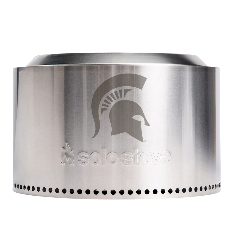 A large, stainless steel portable flameless fire pit with the MSU spartan helmet logo on the side. 