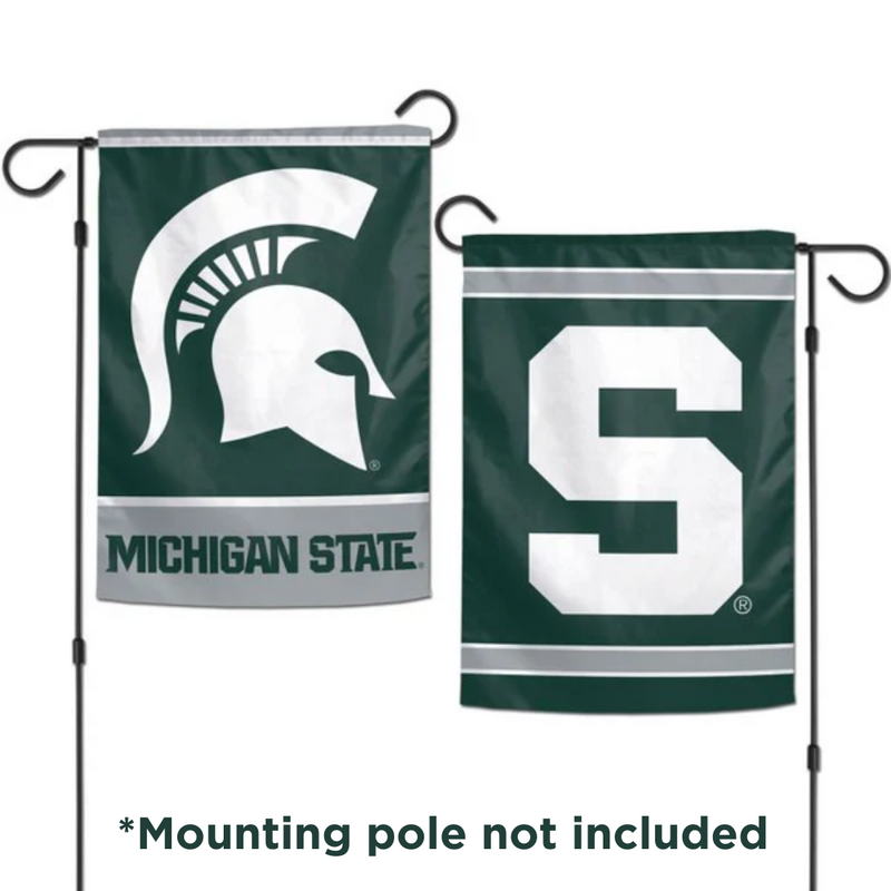 A photo of each side of a two-sided garden flag. On the left is a green flag with a white Spartan helmet logo and the Michigan State wordmark. On the right is a green flag with a white block S logo. At the bottom is the text "*Mounting pole not included."