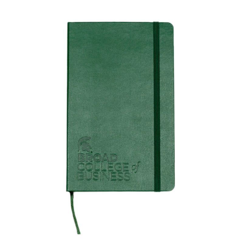 The cover of a green, leather bound notebook with the MSU Spartan logo and "Broad College of Business" engraved in the bottom left corner. 
