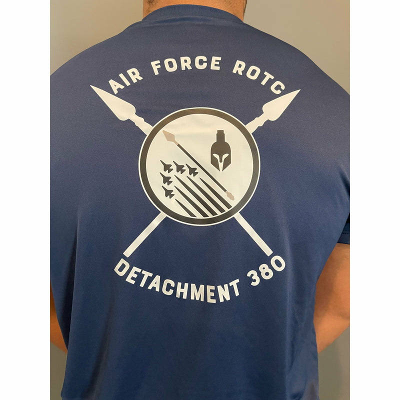 Back of a man wearing a blue athletic t-shirt. On the center is a black and white screen print of the AFROTC detachment 380 logo of 5 fighter jets, a spear, and a spartan helmet over two crossed spears. Along the top and bottom curved text spells out Air Force ROTC Detachment 380 in white block letters