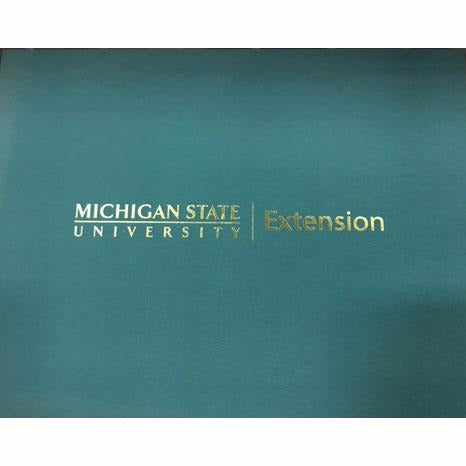 Front side of a certificate holder in spartan green accompanied by the MSU extension signature. 